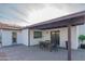 Covered patio with dining set, perfect for outdoor entertaining at 3402 E Sunnyside Dr, Phoenix, AZ 85028