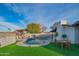 Amazing backyard with a kidney-shaped pool, pergola, and patio furniture at 3402 E Sunnyside Dr, Phoenix, AZ 85028