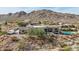 Aerial view of house, highlighting the backyard oasis and mountain views at 34157 N Mirage Ct, San Tan Valley, AZ 85144