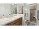 Elegant bathroom with granite vanity and walk-in shower at 34157 N Mirage Ct, San Tan Valley, AZ 85144