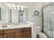 Modern bathroom with granite countertop and walk-in shower at 34157 N Mirage Ct, San Tan Valley, AZ 85144