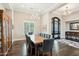 Elegant dining room with hardwood floors, a large table, and a beautiful chandelier at 34157 N Mirage Ct, San Tan Valley, AZ 85144