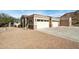 Stunning home exterior with a three-car garage and a paved driveway at 34157 N Mirage Ct, San Tan Valley, AZ 85144