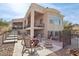 Home exterior with firepit and rocking chairs at 34157 N Mirage Ct, San Tan Valley, AZ 85144