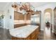 Large kitchen with island and stainless steel appliances at 34157 N Mirage Ct, San Tan Valley, AZ 85144