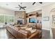 Living room features a stone fireplace, hardwood floors, and comfortable seating at 34157 N Mirage Ct, San Tan Valley, AZ 85144