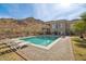 Inviting pool and patio area with mountain backdrop at 34157 N Mirage Ct, San Tan Valley, AZ 85144