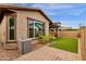 Artificial turf, block wall, and paver patio at 3432 E Alfalfa Dr, Gilbert, AZ 85298