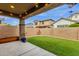 Covered patio, artificial turf, and block wall at 3432 E Alfalfa Dr, Gilbert, AZ 85298