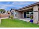 Covered patio, artificial turf, and block wall at 3432 E Alfalfa Dr, Gilbert, AZ 85298