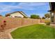 Artificial turf, block wall, and paver patio at 3432 E Alfalfa Dr, Gilbert, AZ 85298