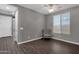 Bright bedroom with wood-look floors and ceiling fan at 3432 E Alfalfa Dr, Gilbert, AZ 85298