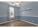 Bedroom with wood-look floors, window, and shelf at 3432 E Alfalfa Dr, Gilbert, AZ 85298