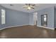 Spacious bedroom featuring wood floors and ceiling fan at 3432 E Alfalfa Dr, Gilbert, AZ 85298