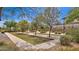 Landscaped bocce ball court with benches for players to relax at 3432 E Alfalfa Dr, Gilbert, AZ 85298