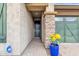 Front entry with stone columns and a blue flower pot at 3432 E Alfalfa Dr, Gilbert, AZ 85298