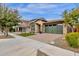 Front view of a charming house with a green garage door at 3432 E Alfalfa Dr, Gilbert, AZ 85298