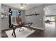 Modern home office with a dark desk and floor-to-ceiling windows at 3432 E Alfalfa Dr, Gilbert, AZ 85298