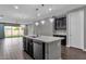 Modern kitchen with island, dark cabinetry, and pendant lighting at 3432 E Alfalfa Dr, Gilbert, AZ 85298