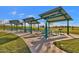 Community picnic area with shaded tables and grills at 3432 E Alfalfa Dr, Gilbert, AZ 85298