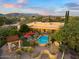 Stunning aerial view showcasing the home, pool, and mountain backdrop at 37018 N Tree Lined Trl, Carefree, AZ 85377