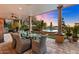 Gorgeous patio with seating area, pool views, and sunset ambiance at 37018 N Tree Lined Trl, Carefree, AZ 85377