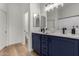 Modern bathroom with dual vanity and navy blue cabinets at 3718 E Elmington Cir, San Tan Valley, AZ 85140