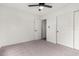 Well-lit bedroom featuring ceiling fan and double doors at 3718 E Elmington Cir, San Tan Valley, AZ 85140