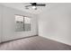 Bright bedroom with window and ceiling fan at 3718 E Elmington Cir, San Tan Valley, AZ 85140