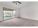 Bright bedroom with sliding glass door to backyard and ceiling fan at 3718 E Elmington Cir, San Tan Valley, AZ 85140