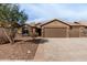 Single-story home with three-car garage and landscaped front yard at 3718 E Elmington Cir, San Tan Valley, AZ 85140