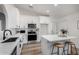 Modern kitchen with white cabinets, stainless steel appliances and island at 3718 E Elmington Cir, San Tan Valley, AZ 85140