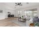 Light and airy living room with a neutral color palette and hardwood floors at 3718 E Elmington Cir, San Tan Valley, AZ 85140