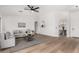 Living room with hardwood floors, neutral decor, and an open floor plan at 3718 E Elmington Cir, San Tan Valley, AZ 85140