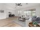 Living room featuring hardwood floors, neutral decor, and a ceiling fan at 3718 E Elmington Cir, San Tan Valley, AZ 85140