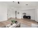 Bright living room with light hardwood floors and modern furniture at 3718 E Elmington Cir, San Tan Valley, AZ 85140