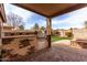 Outdoor kitchen with built-in grill and prep area at 3718 E Elmington Cir, San Tan Valley, AZ 85140