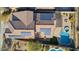 Aerial view showcasing home with solar panels and pool at 38213 N Raleigh Way, Anthem, AZ 85086