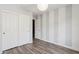 Spacious bedroom with gray and white striped wall at 38213 N Raleigh Way, Anthem, AZ 85086