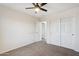 Bedroom with ceiling fan and double doors at 38213 N Raleigh Way, Anthem, AZ 85086