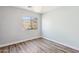 Bedroom with mountain views and wood-look floors at 38213 N Raleigh Way, Anthem, AZ 85086