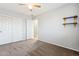 Bedroom with ceiling fan and double doors at 38213 N Raleigh Way, Anthem, AZ 85086