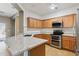 Modern kitchen with granite counters and stainless steel appliances at 38213 N Raleigh Way, Anthem, AZ 85086