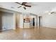 Living room with kitchen island and tile floors at 38213 N Raleigh Way, Anthem, AZ 85086