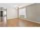 Bright and airy living room with tile flooring and ceiling fan at 38213 N Raleigh Way, Anthem, AZ 85086