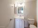 Clean bathroom features a vanity with storage and a toilet at 4050 E Cactus Rd # 201, Phoenix, AZ 85032