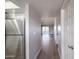 Bright hallway with wood floors leads to living area at 4050 E Cactus Rd # 201, Phoenix, AZ 85032