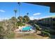 Community pool with surrounding patio and lounge chairs at 4050 E Cactus Rd # 201, Phoenix, AZ 85032