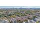 Aerial view of neighborhood with mountain views in the distance at 40901 N Courage Trl, Anthem, AZ 85086