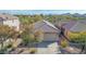 Aerial view of house and neighborhood with mountain views at 40901 N Courage Trl, Anthem, AZ 85086